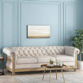 Button-down tufted three-seater sofa with wooden sofa legs